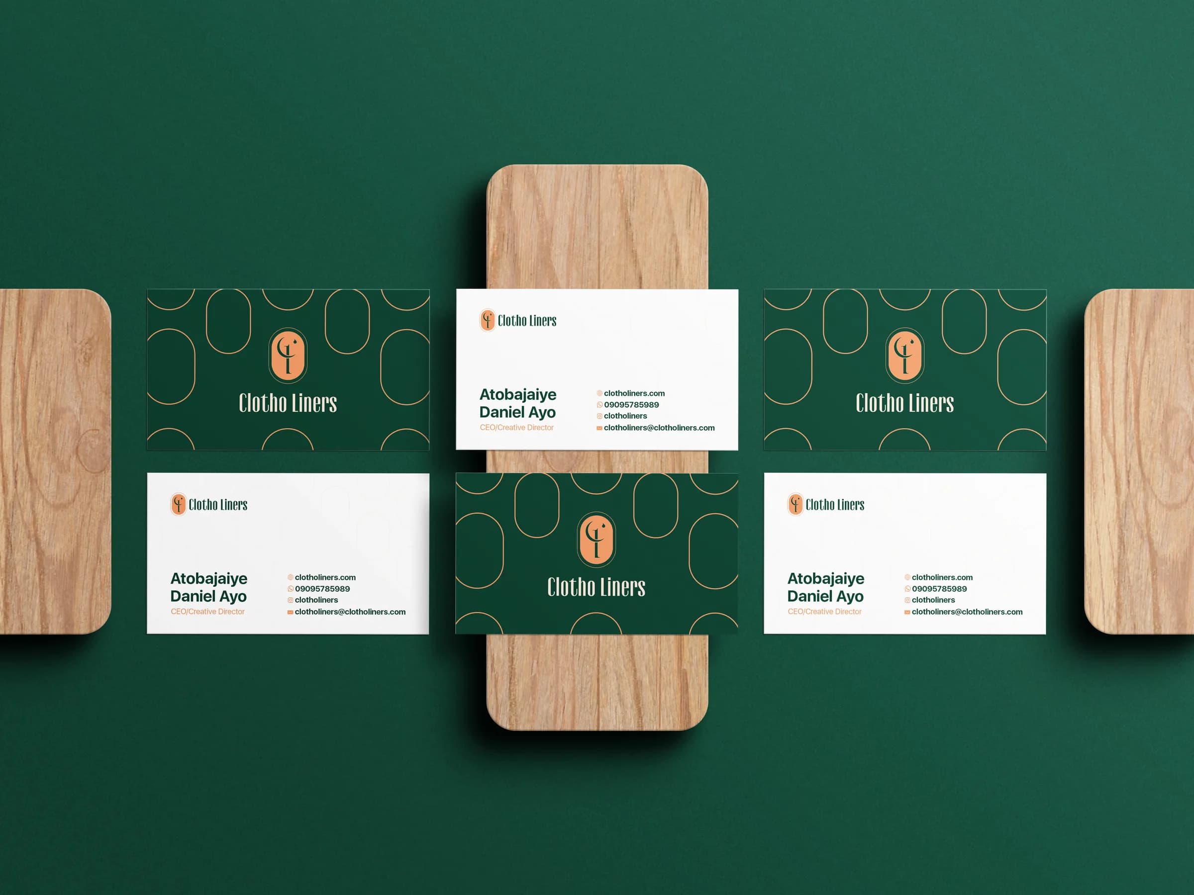 Clotho Liners business cards on wood