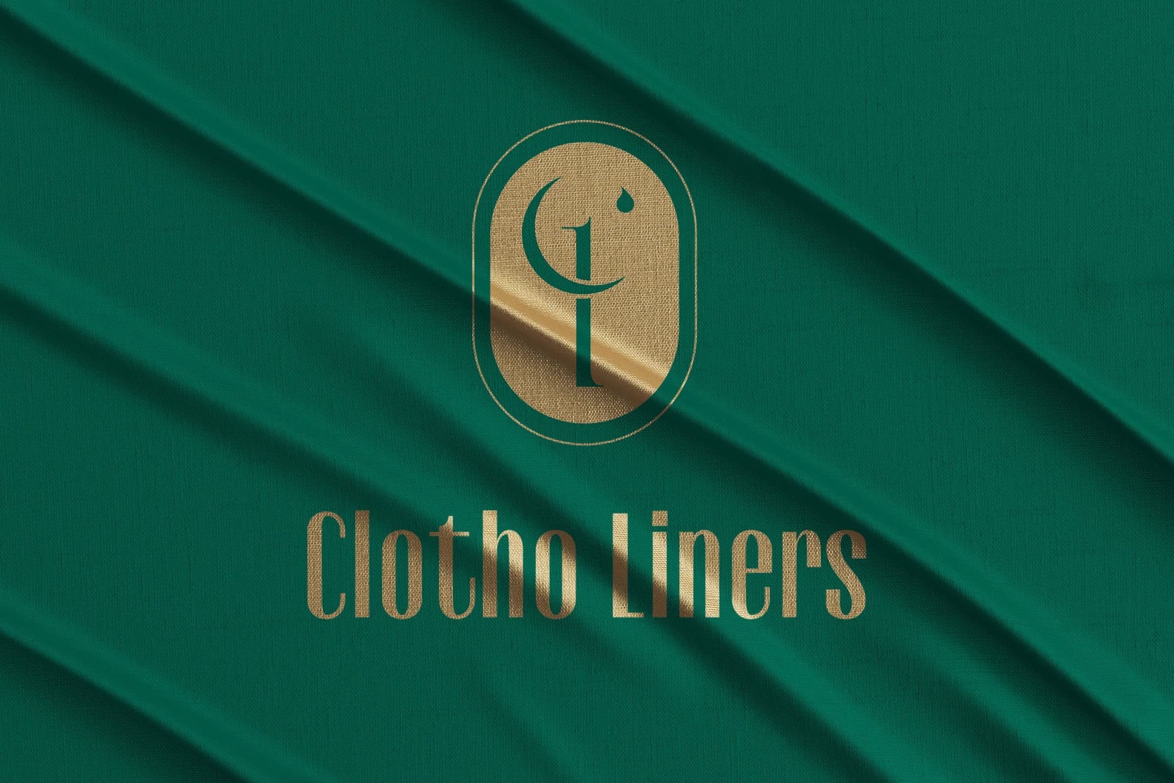 Clotho Liners logo in gold on green fabric